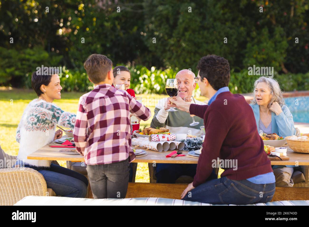 Caucasian family spending time together outside and having meal Stock Photo