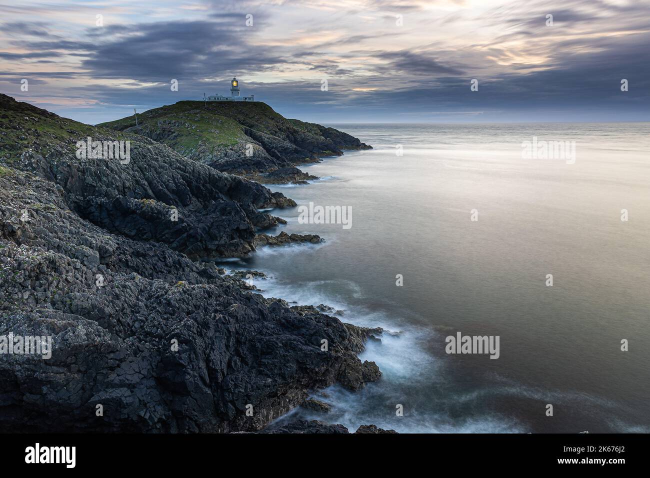 Strumble Head Lighthouse at sunset, Goodwick, Wales, United Kingdom Stock Photo