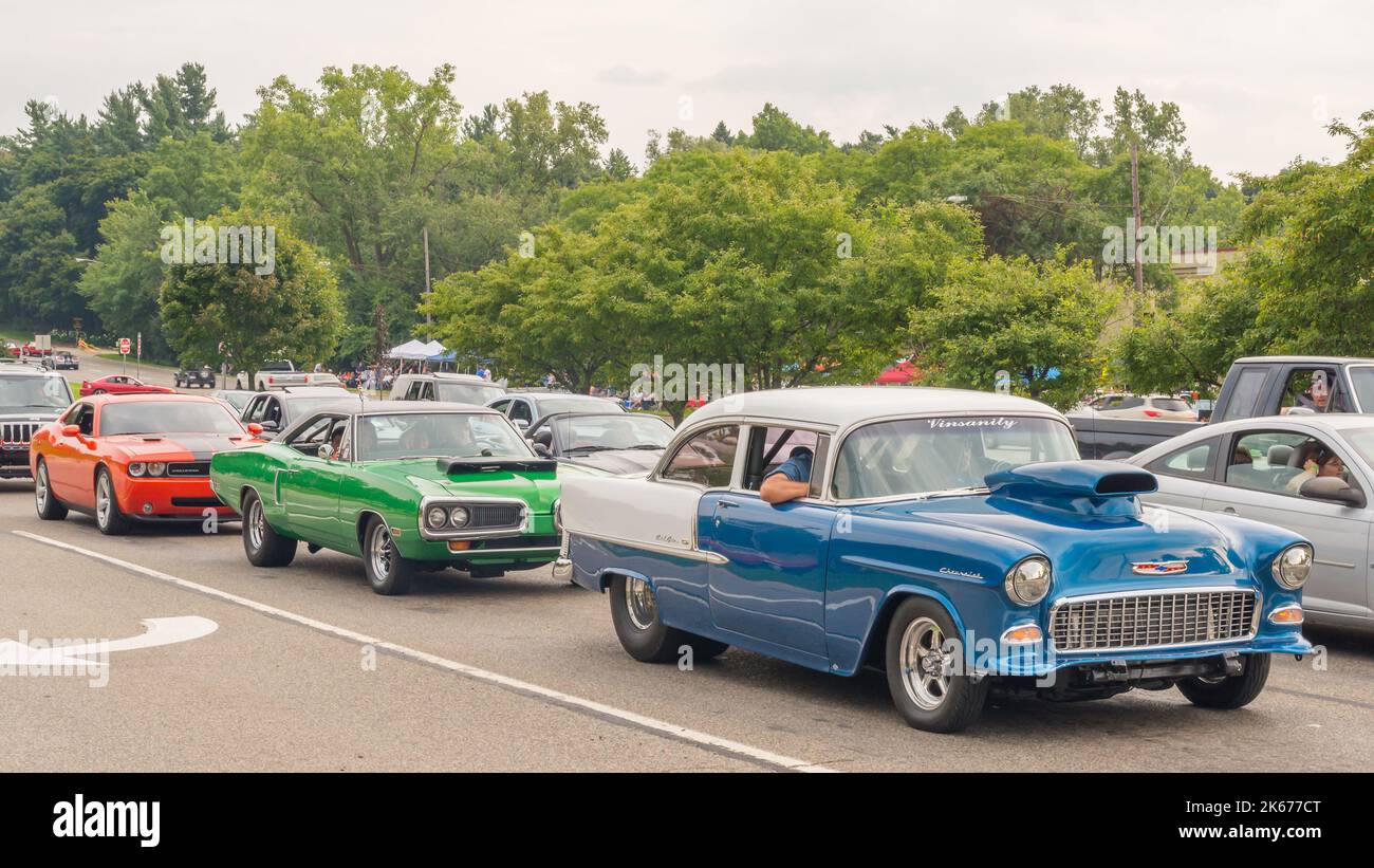 BLOOMFIELD HILLS, MI/USA - AUGUST 16, 2014: A Dodge Challenger, 1970 Dodge Coronet Super Bee, 1955 Chevrolet Bel Air cars, Woodward Dream Cruise. Stock Photo