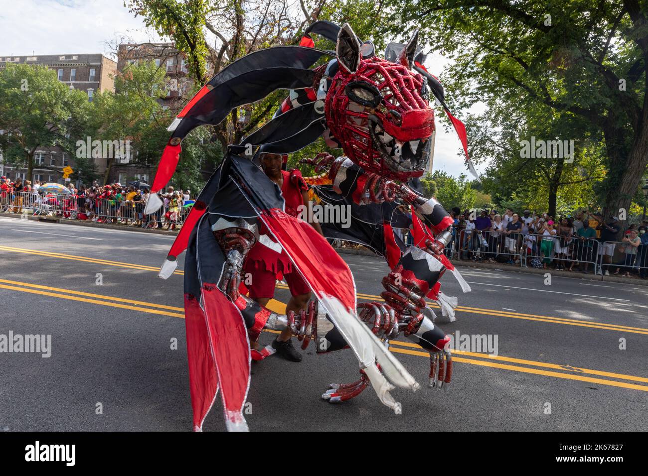 The West Indian Labor Day Parade with a man in a red dragon costume and