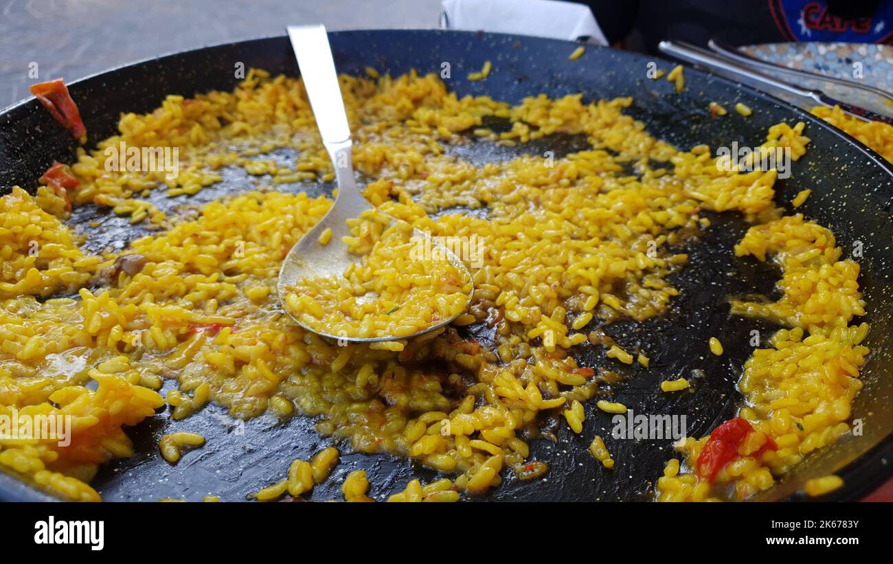 the few grains of rice left in the paella pan Stock Photo Alamy