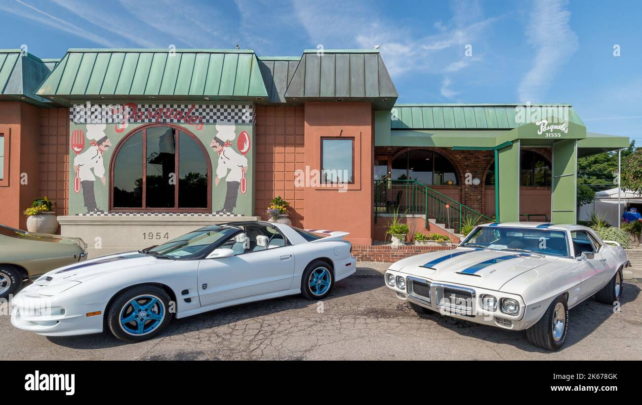 ROYAL OAK, MI/USA - AUGUST 15, 2014: Two Pontiac Firebird TransAm cars at historic Pasquale's restaurant, Woodward Dream Cruise. Stock Photo