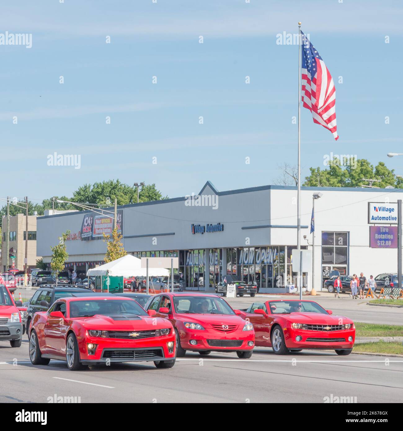 ROYAL OAK, MI/USA - AUGUST 15, 2014: Two Chevrolet Camaros and one Mazda cars, Woodward Dream Cruise. Stock Photo