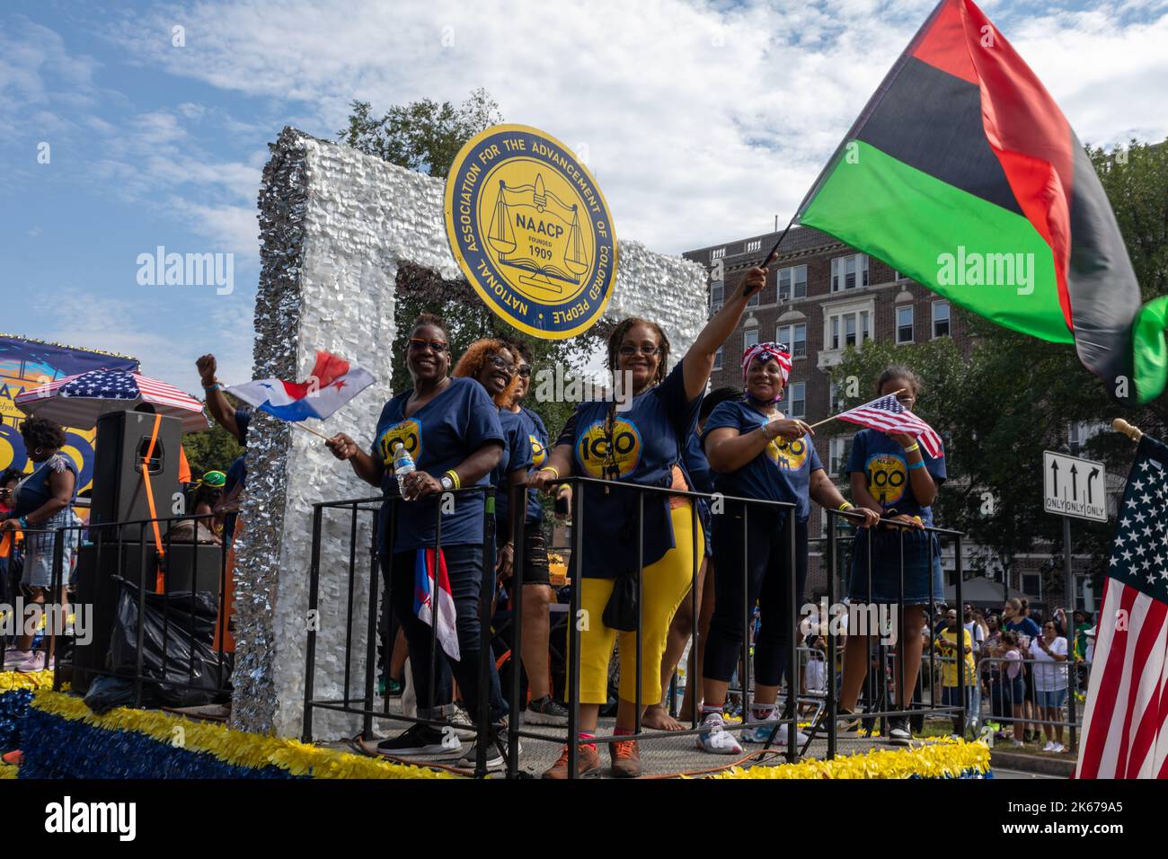 The West Indian Labor Day Parade with a woman holding a PanAfrican