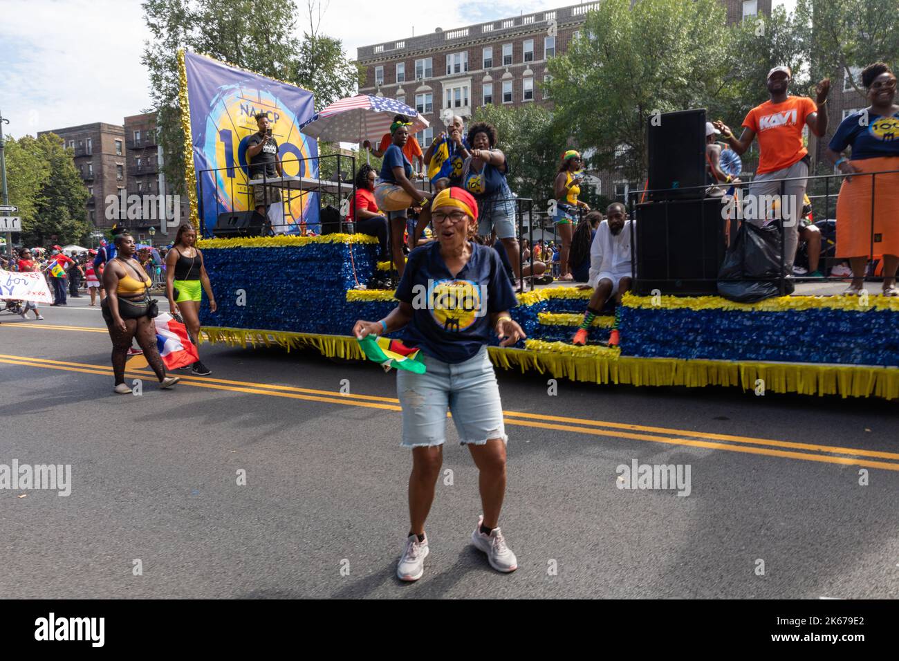 The West Indian Labor Day Parade with a woman standing in front of an