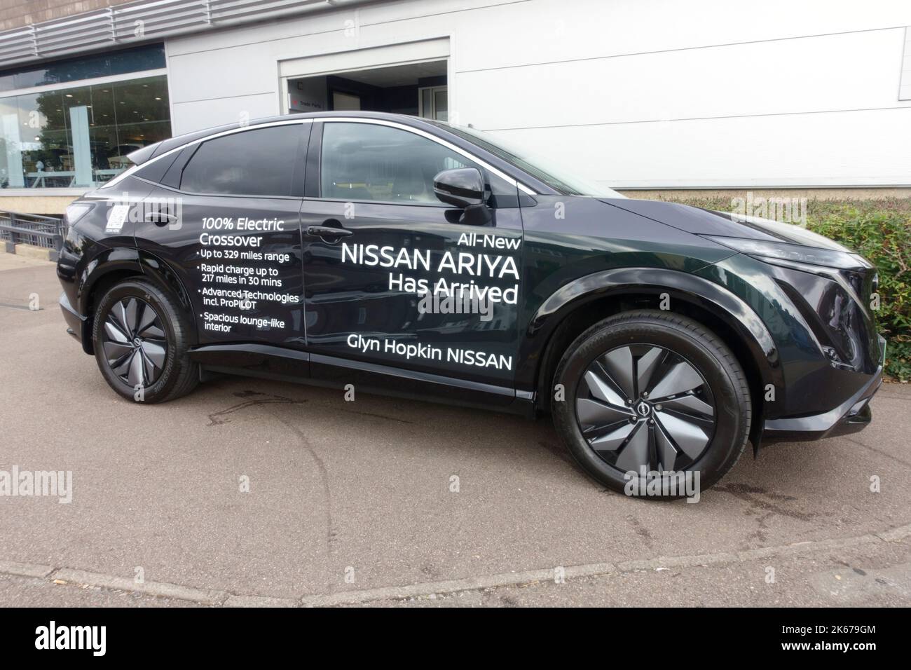 New Nissan Ariya crossover electric car with signage text promoting its