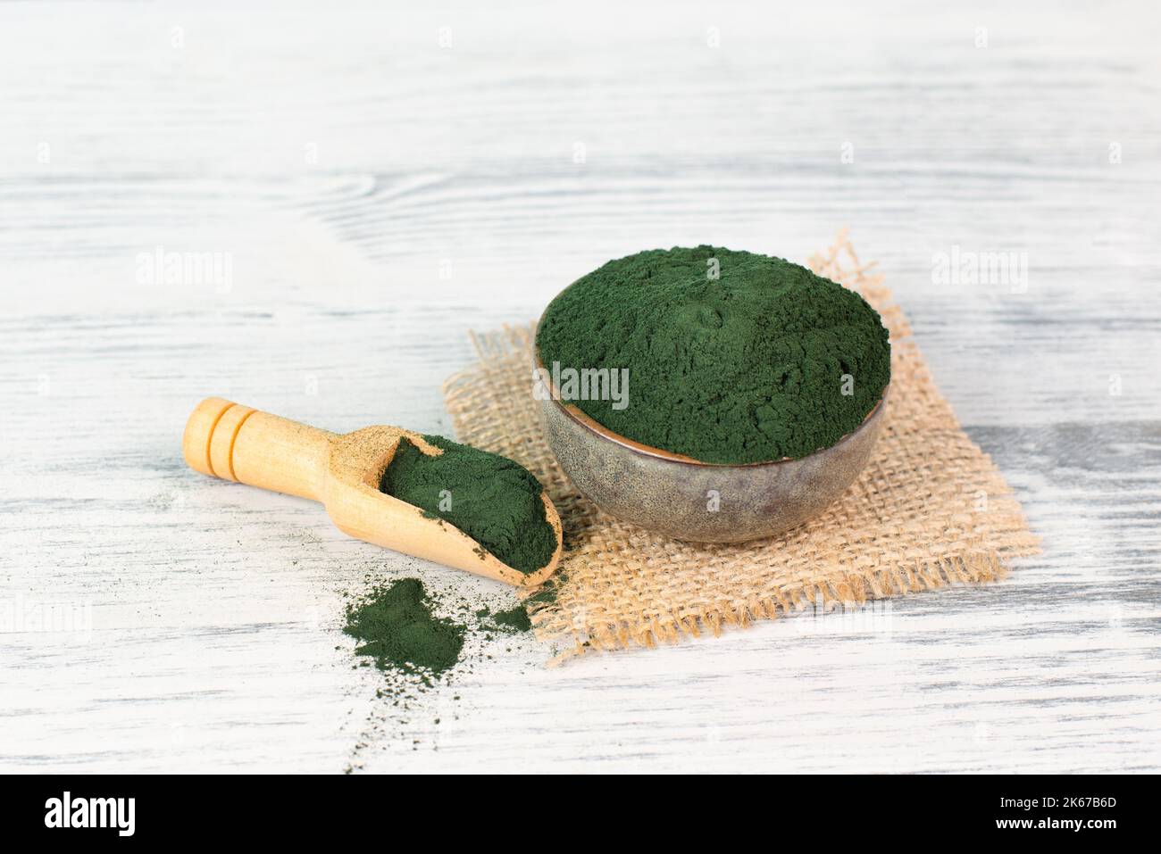 Spirulina algae powder in a bowl, alternative medicine for to detox, antioxidant food ingredients Stock Photo