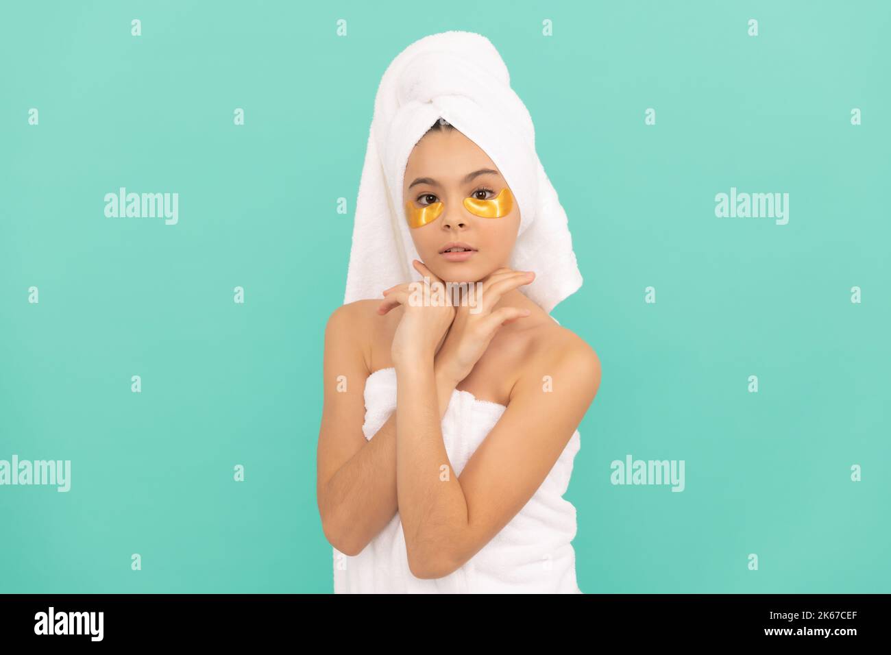 teen girl in shower towel with collagen patch Stock Photo