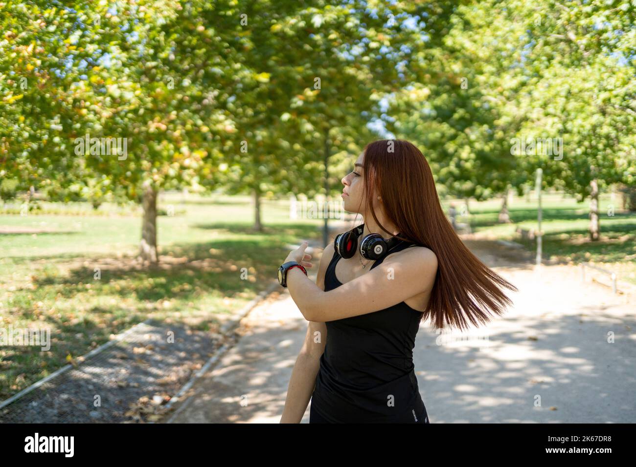 Young woman with photo camera in park Stock Photo