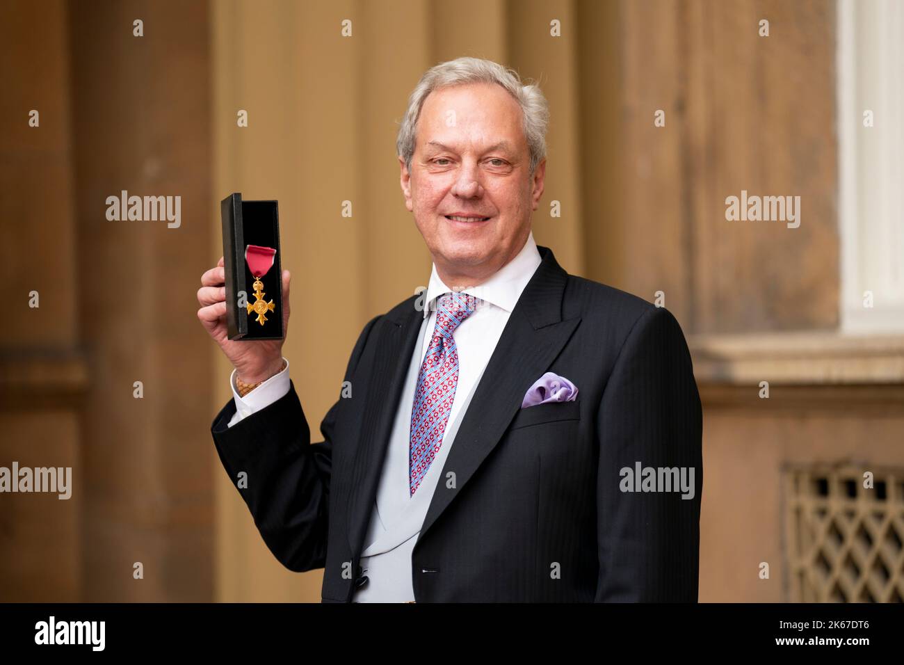 Charles Sabine with his OBE, awarded by the Princess Royal during an