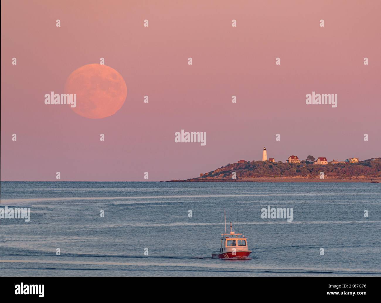 Hunters Moon Rising Next to Bakers Island with Fishing Boat Stock Photo