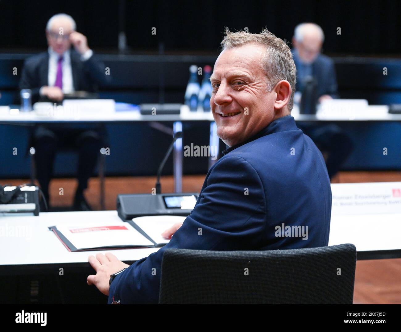 Kornwestheim, Germany. 12th Oct, 2022. Roman Zitzelsberger, head of the Baden-Württemberg district of the IG Metall union, sits in the negotiating room ahead of the second round of collective bargaining in the metal and electrical industry in Baden-Württemberg. Credit: Bernd Weißbrod/dpa/Alamy Live News Stock Photo