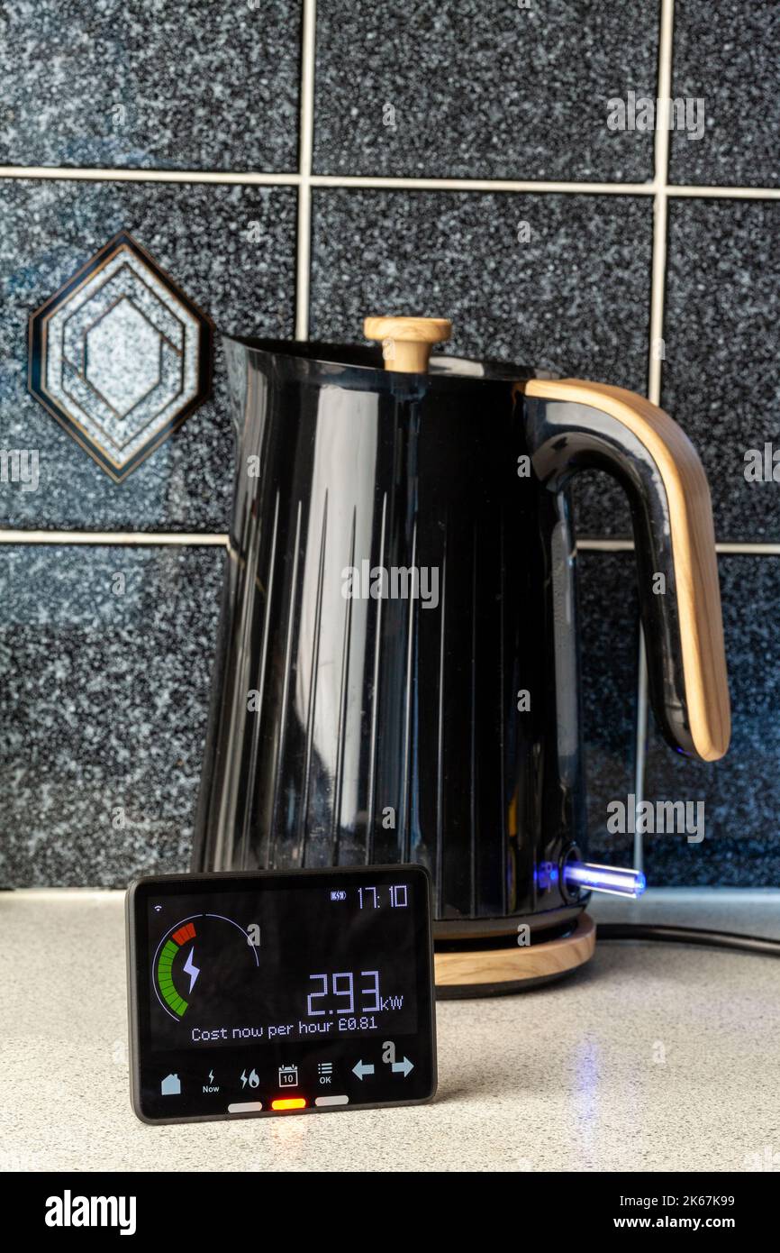 A smart meter in front of a kettle in a kitchen. Stock Photo