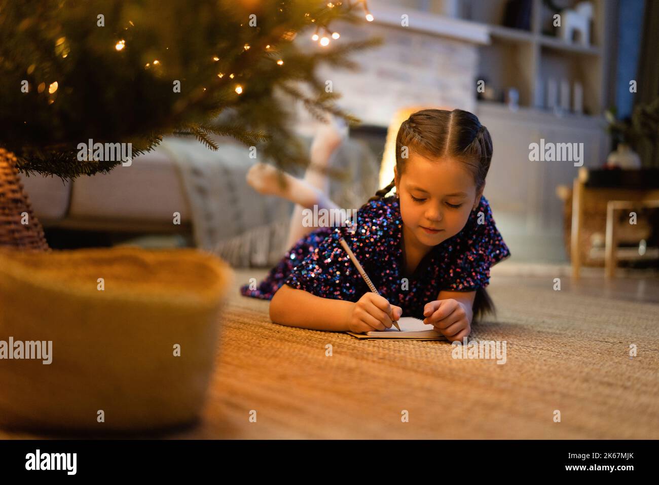 christmas-holidays-and-childhood-concept-smiling-girl-making-wish