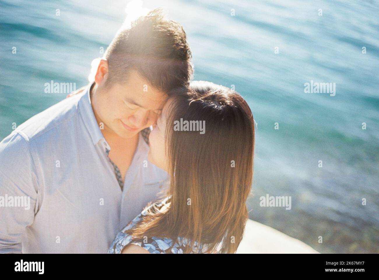 Woman touches forehead in hi-res stock photography and images - Alamy