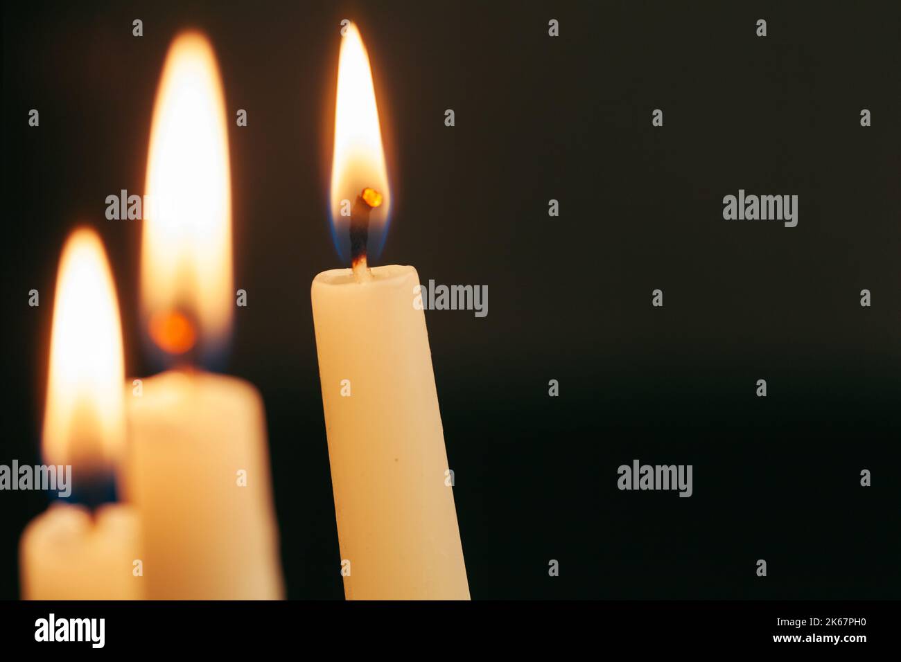 Candle flame close up on a black background Stock Photo - Alamy