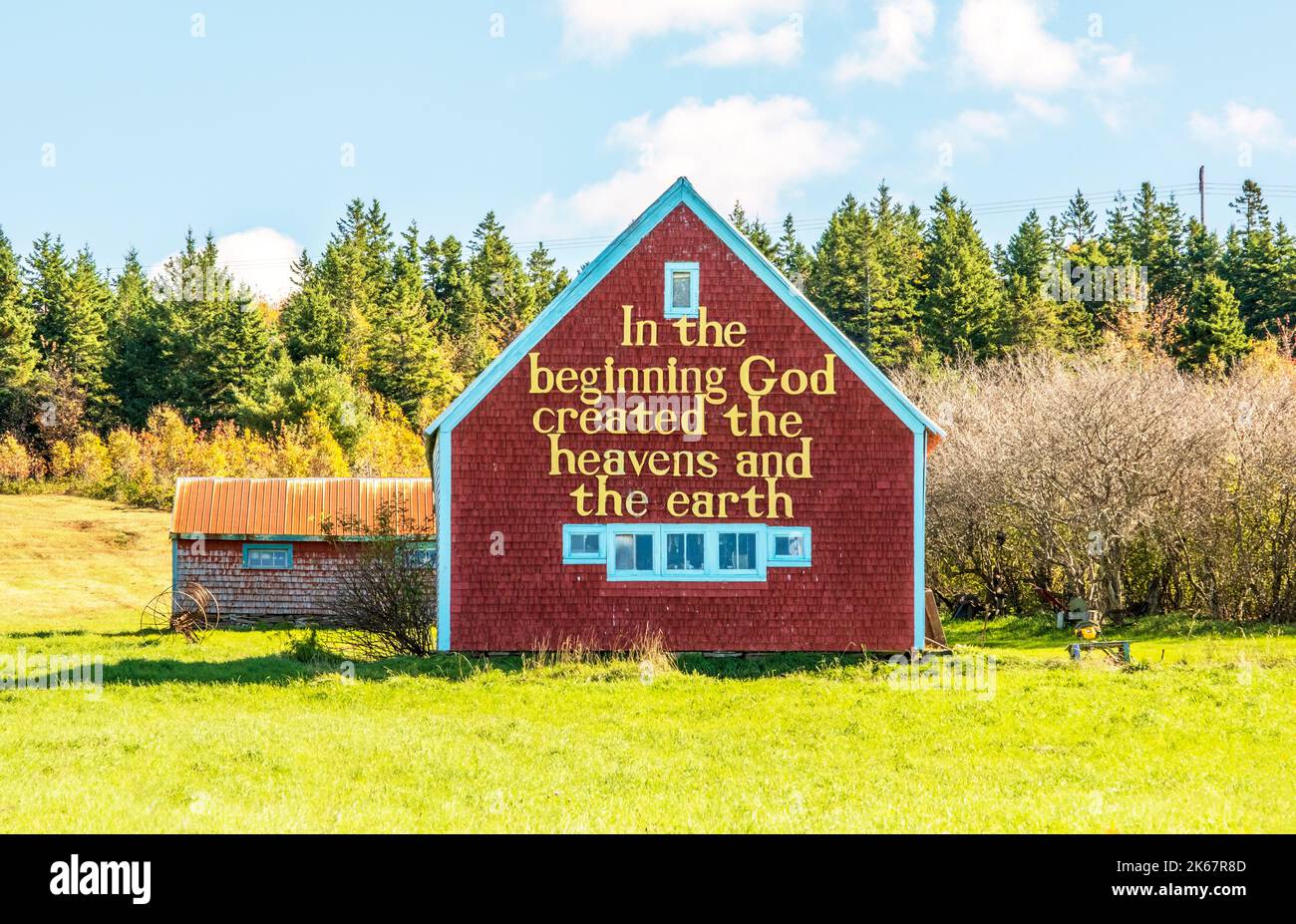 Old barn with a religious iscription pained on the side located on Cape Breton Island. Stock Photo