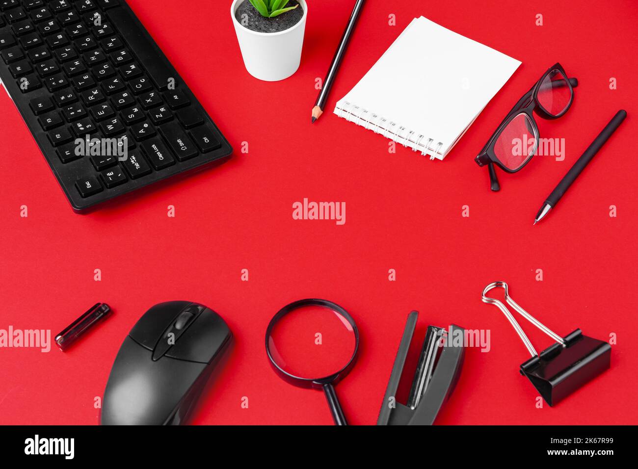Set of stationery items on red office desk Stock Photo Alamy