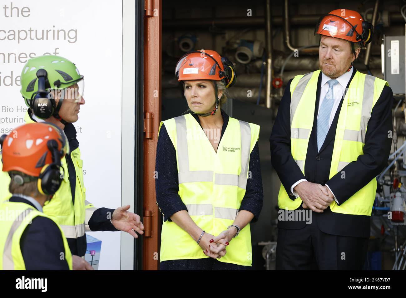 Queen Máxima and King Willem-Alexander wearing helmets while visiting ...