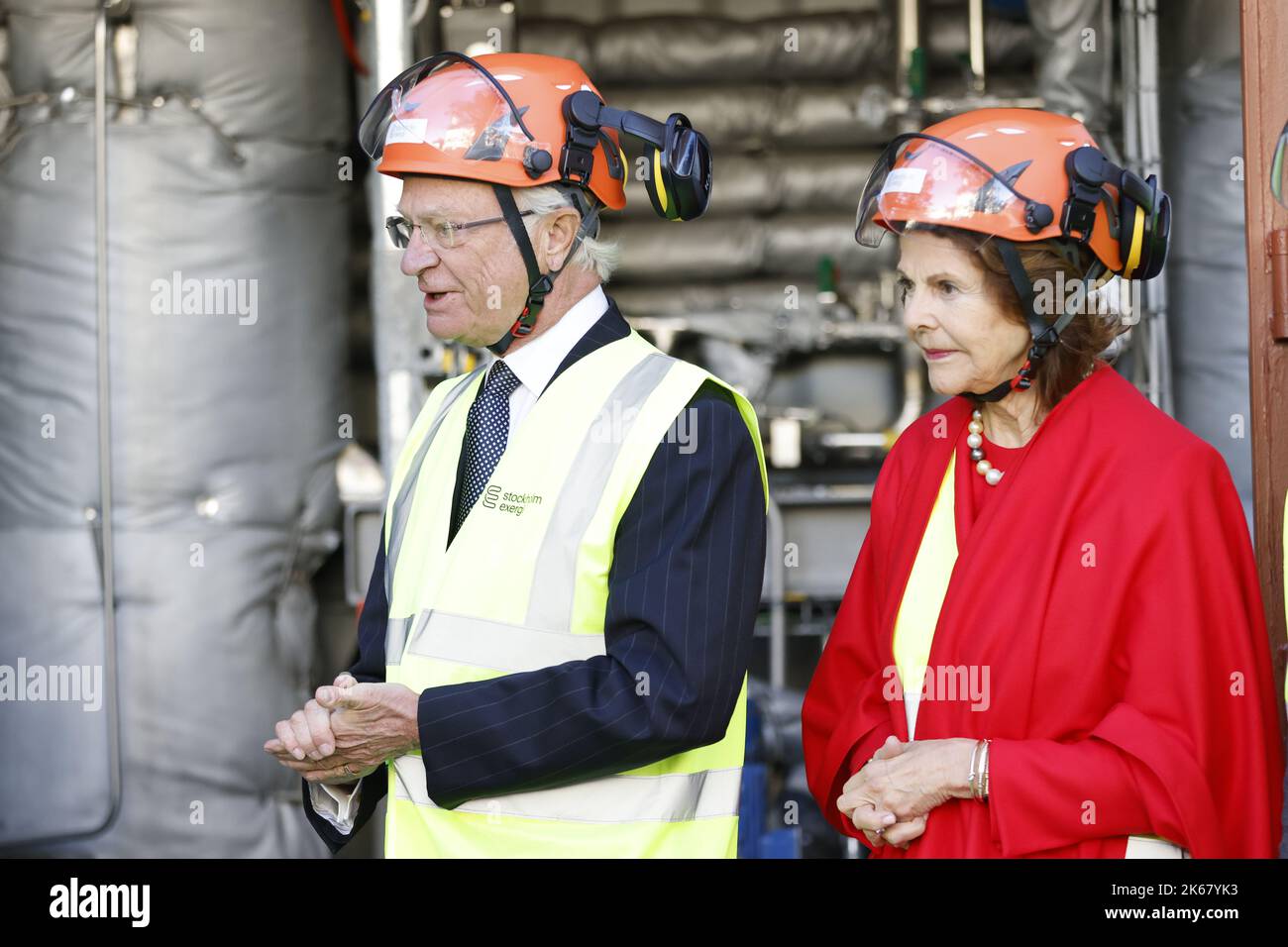 King Carl Gustaf and Queen Silvia wearing helmets while visiting ...