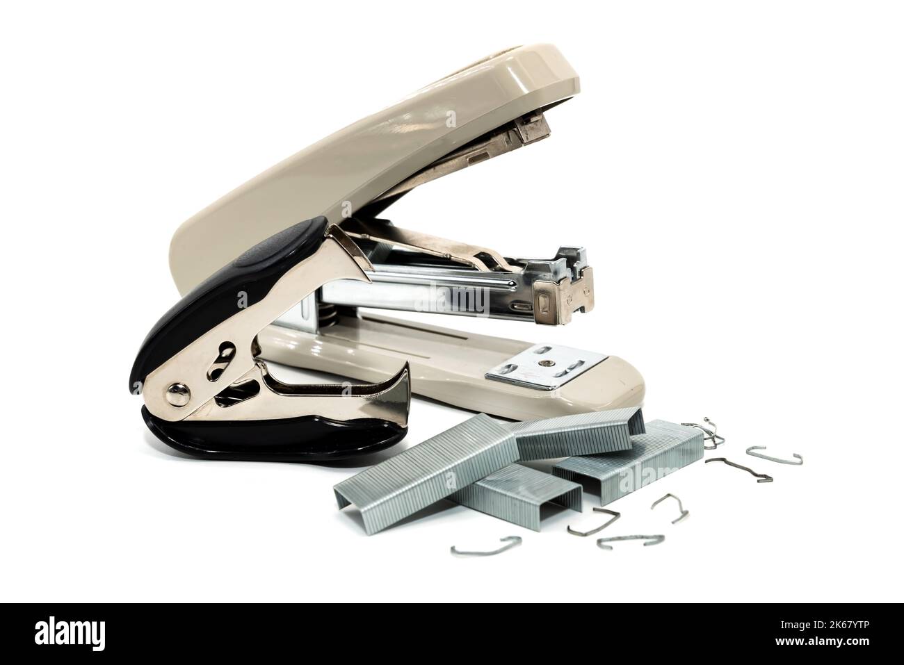 Stapler and anti-stapler with staples on a white background. Office ...