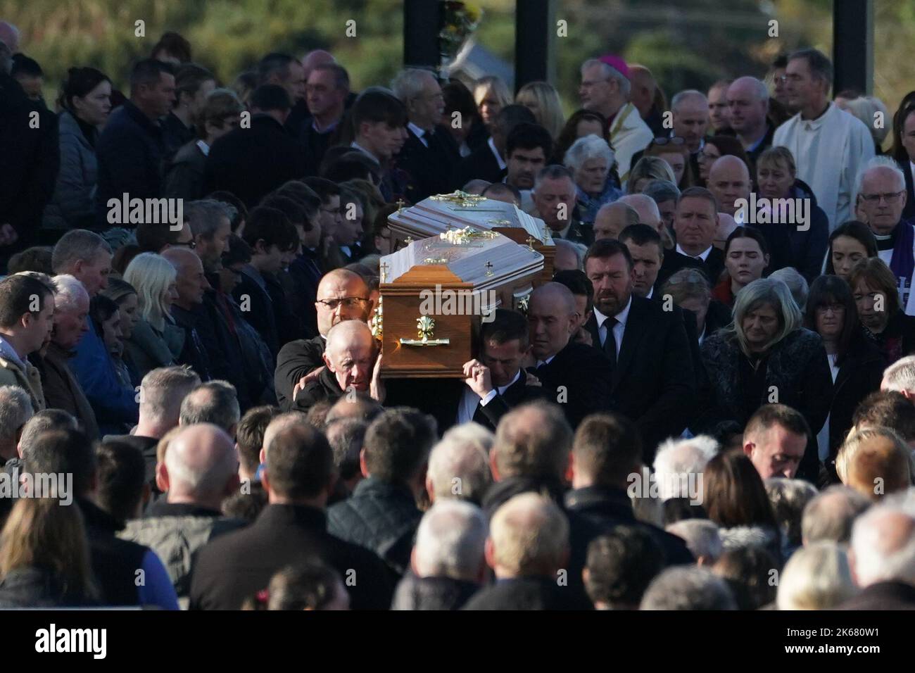 The coffins of James Monaghan and his mother Catherine O'Donnell are carried out of St Michael's Church, Creeslough after their funeral mass. They both died following an explosion at Applegreen service station in the village of Creeslough in Co Donegal on Friday. Picture date: Wednesday October 12, 2022. Stock Photo