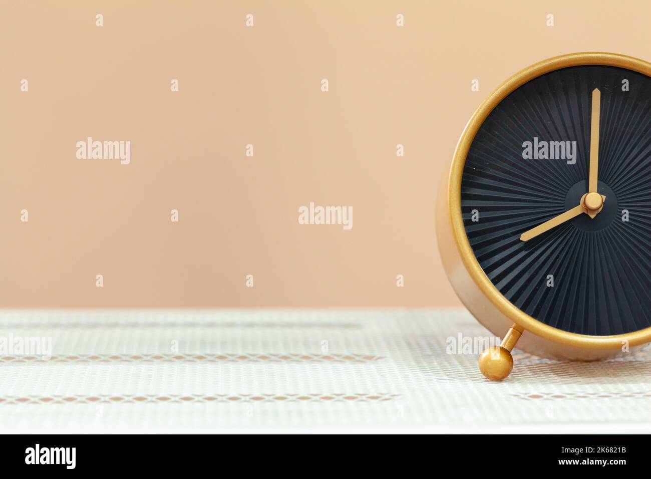 Alarm clock on wooden table close up Stock Photo