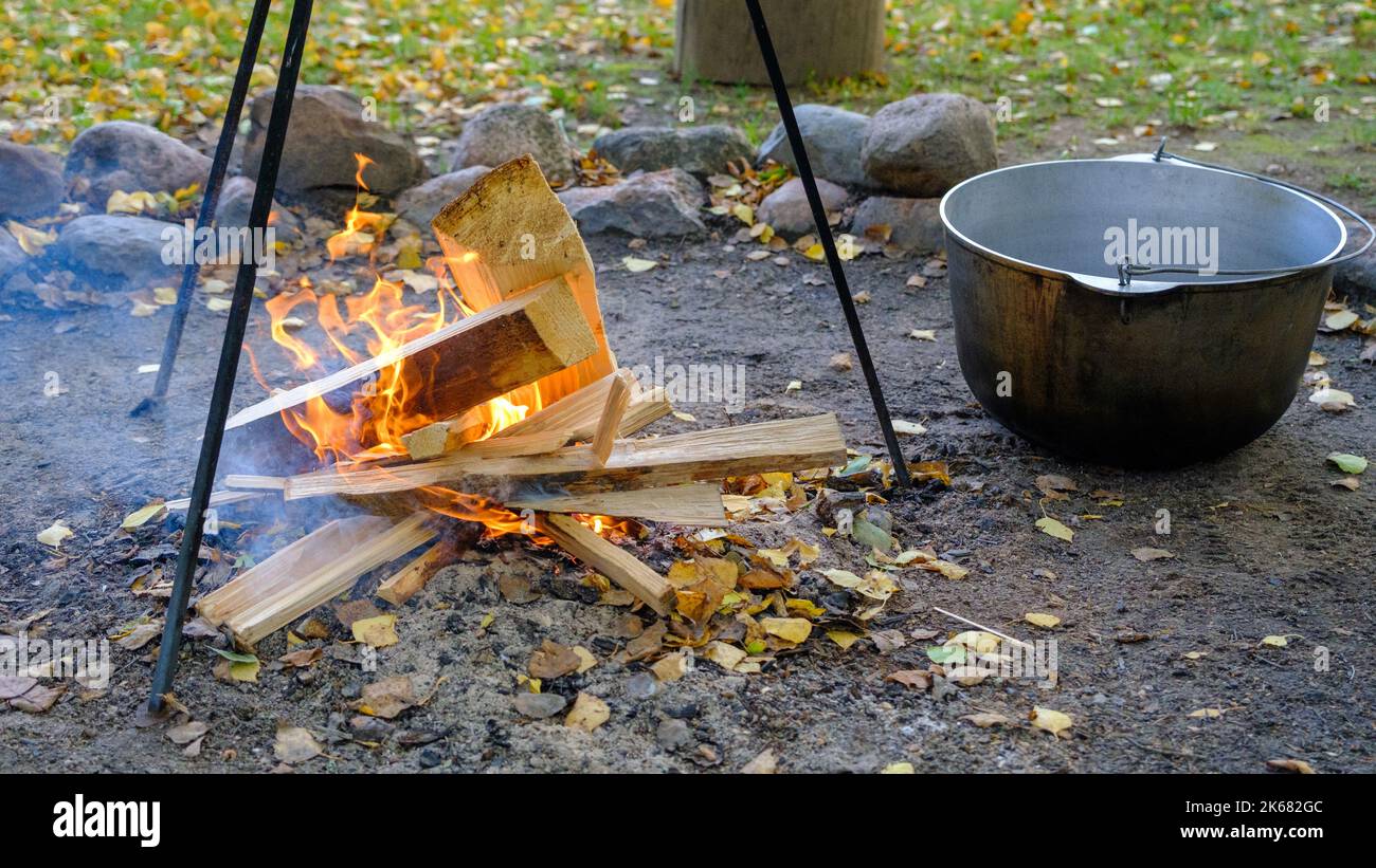Cooking in a pot on an open fire in nature. Bowler on a bonfire in the