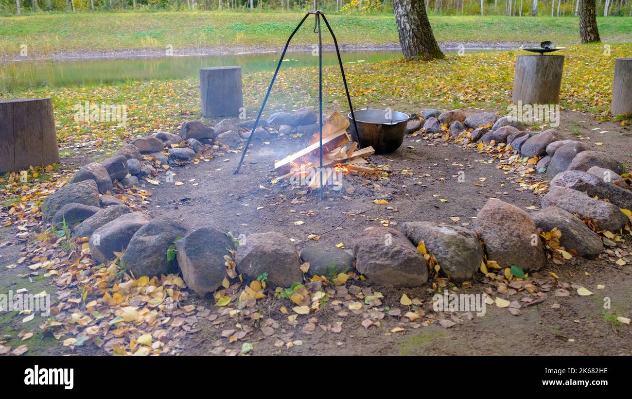 Cooking in a pot on an open fire in nature. Bowler on a bonfire in the