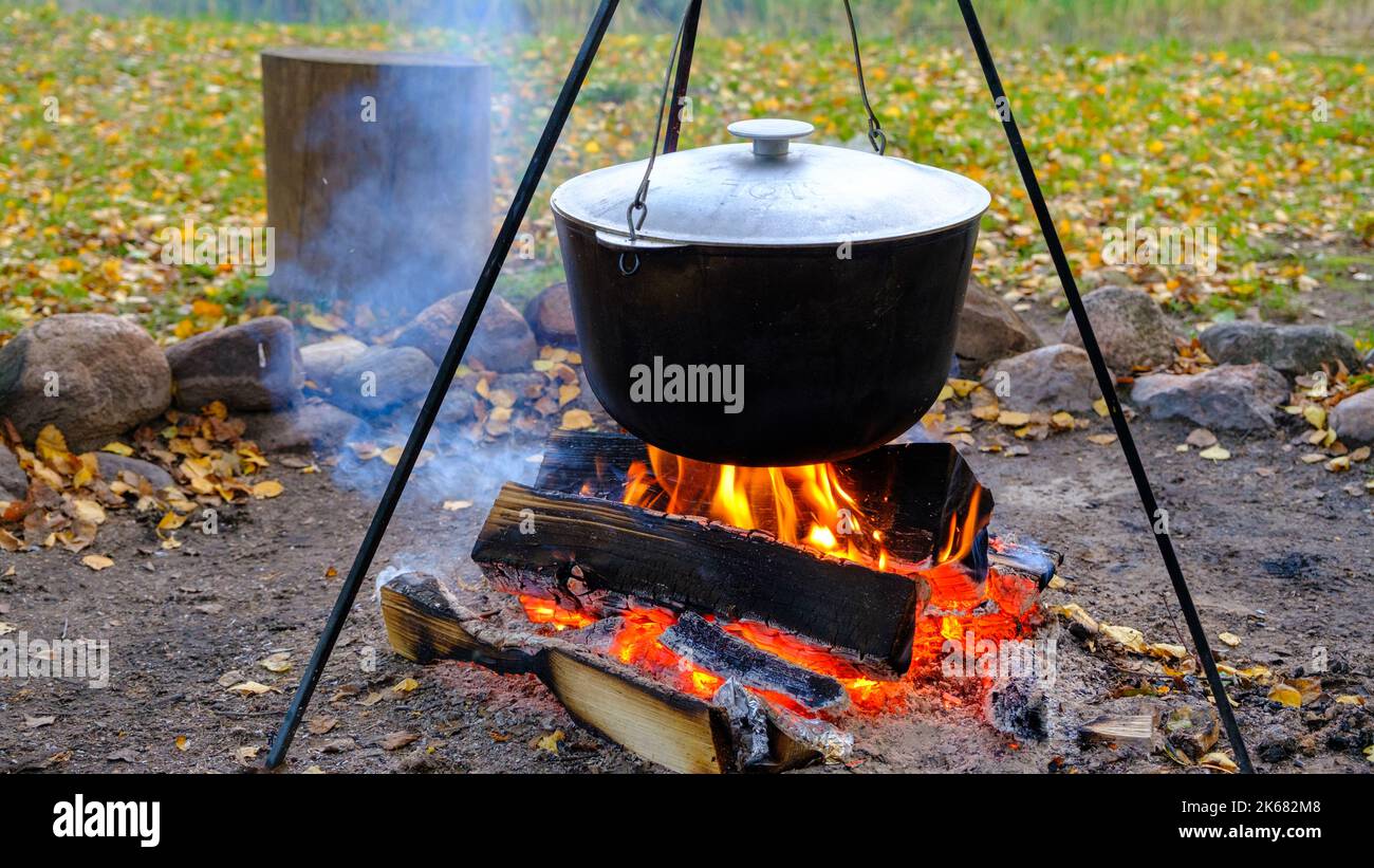 Cooking in a pot on an open fire in nature. Bowler on a bonfire in the