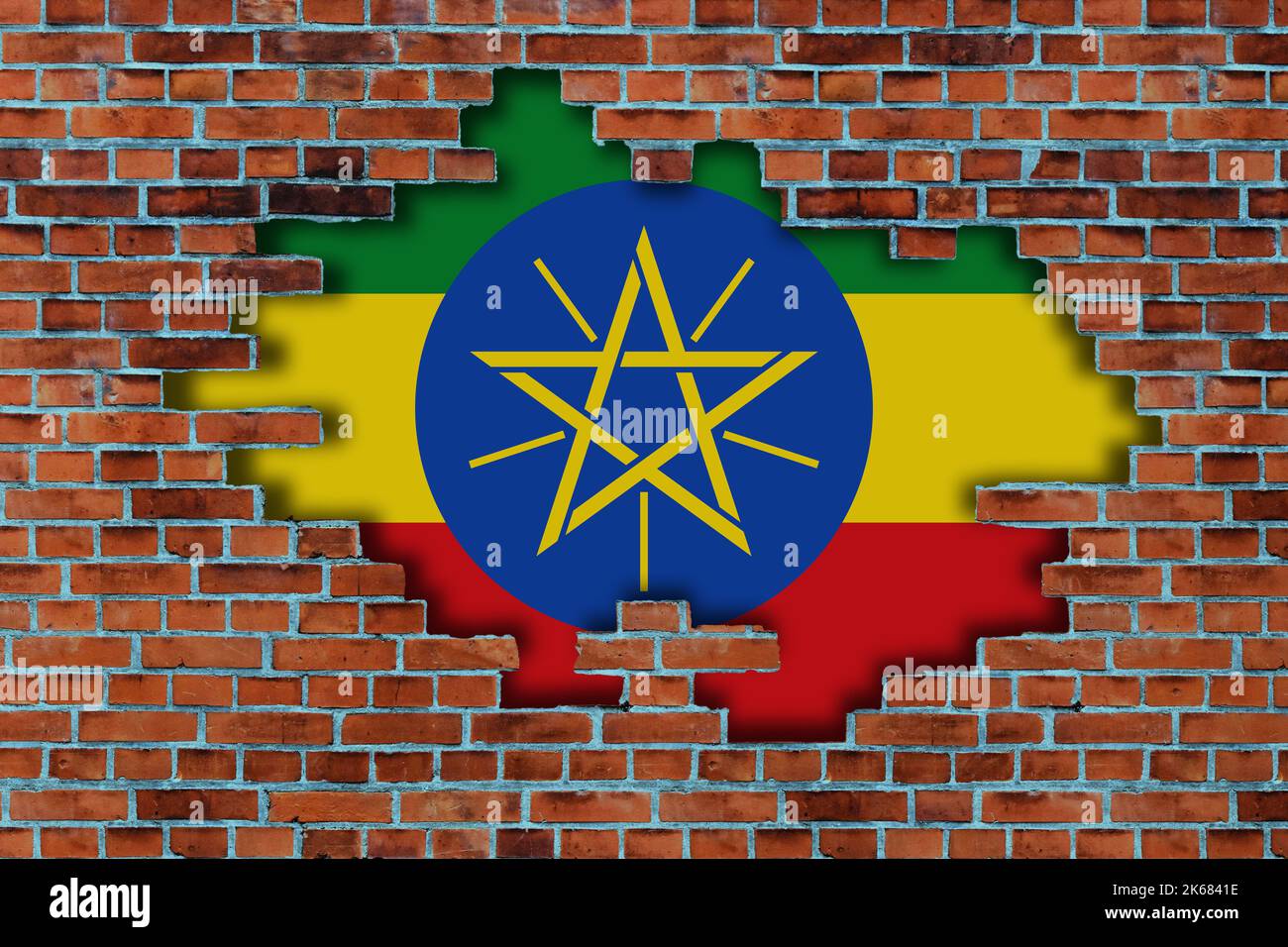 3D Flag of Ethiopia behind the broken old stone wall background Stock ...