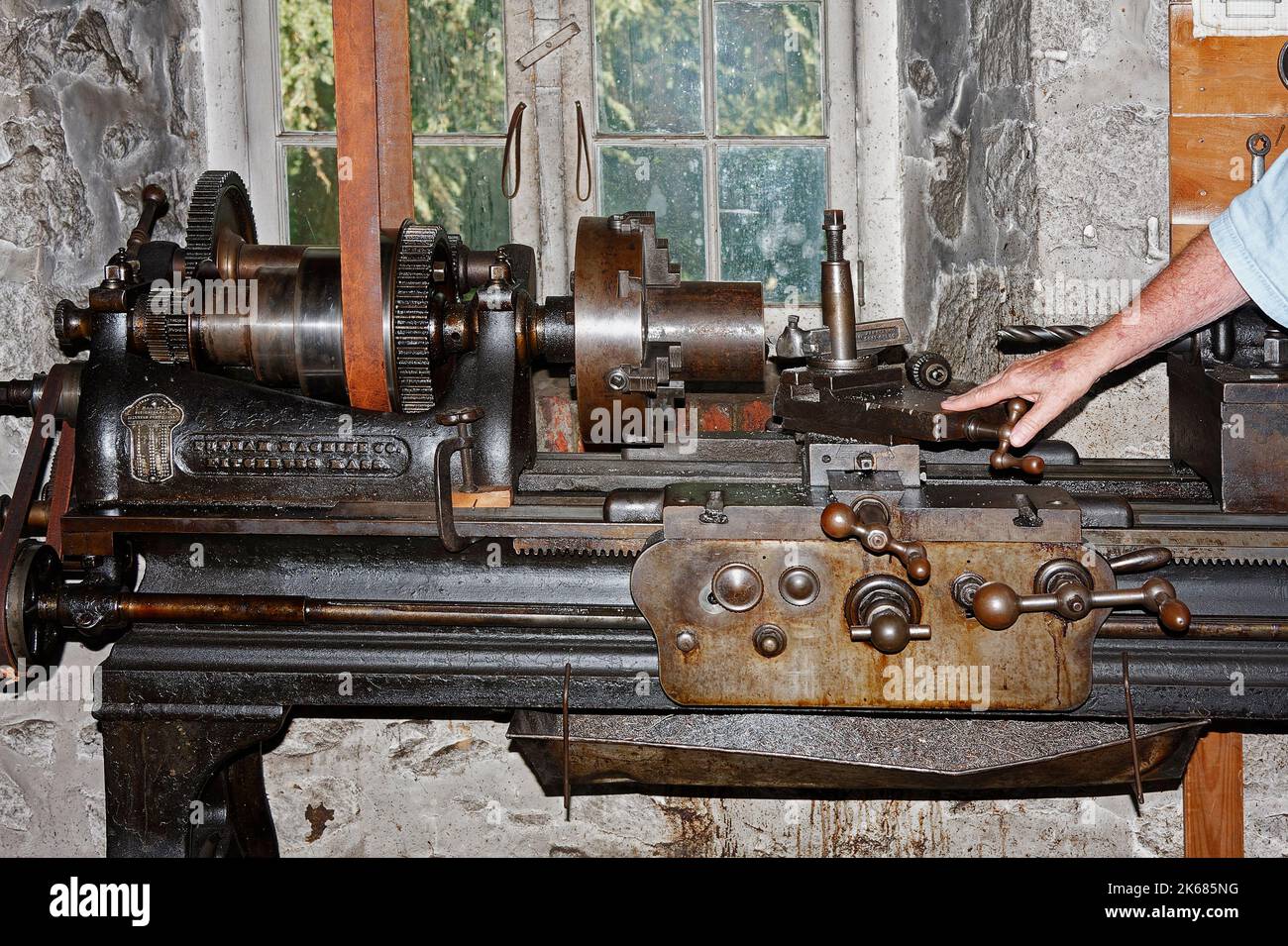 antique machine shop, equipment, industry, man explaining function, Hagley Museum, Delaware, Wilmington, DE Stock Photo