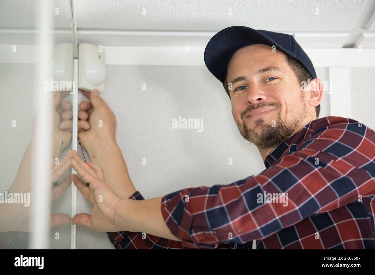 man fixing the plumbing problems under the sink Stock Photo - Alamy