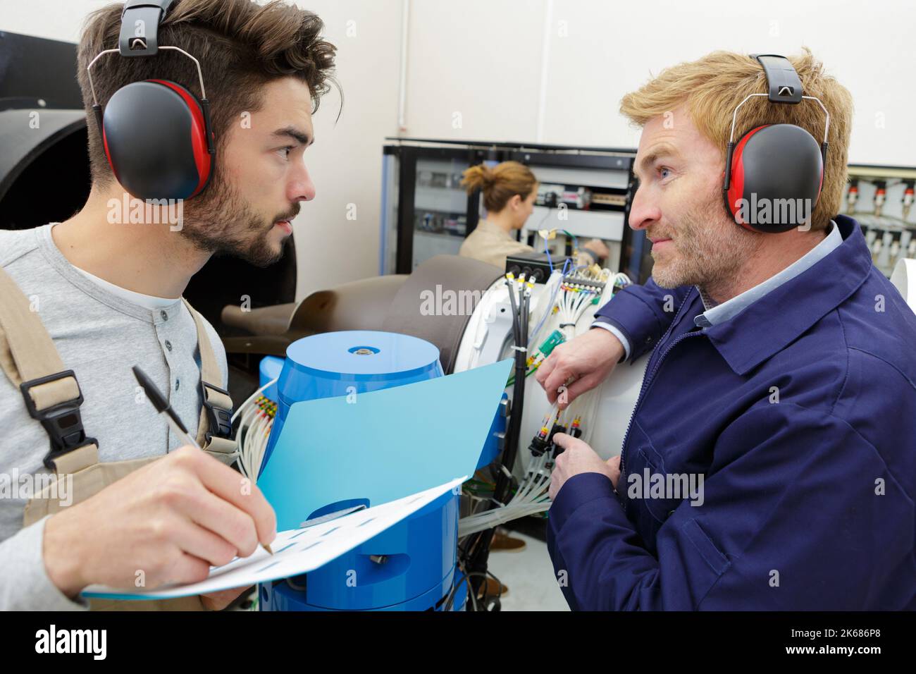 supplier with engineer checking on production in factory Stock Photo