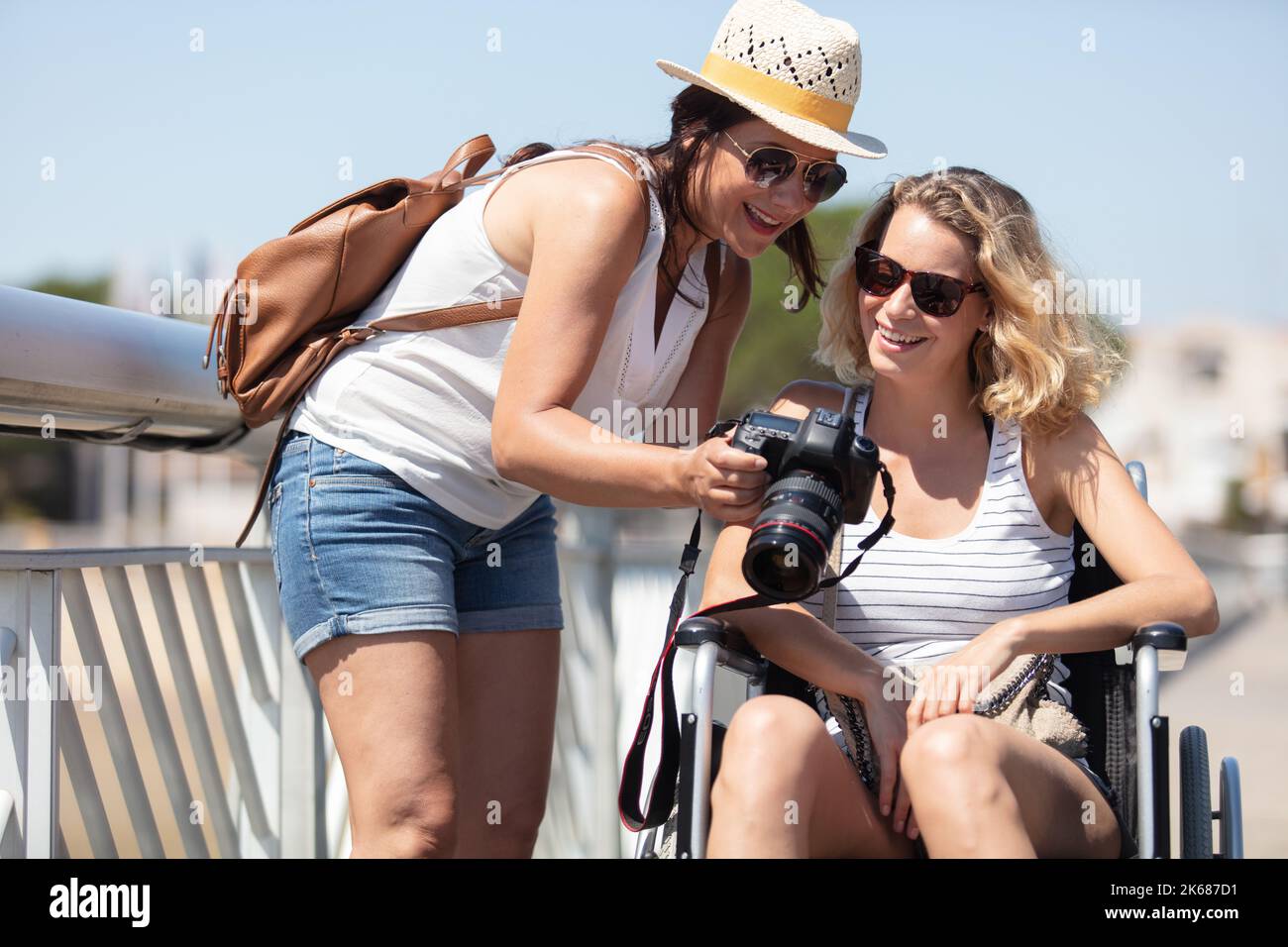 woman and her friend on the wheelchair outdoors Stock Photo - Alamy