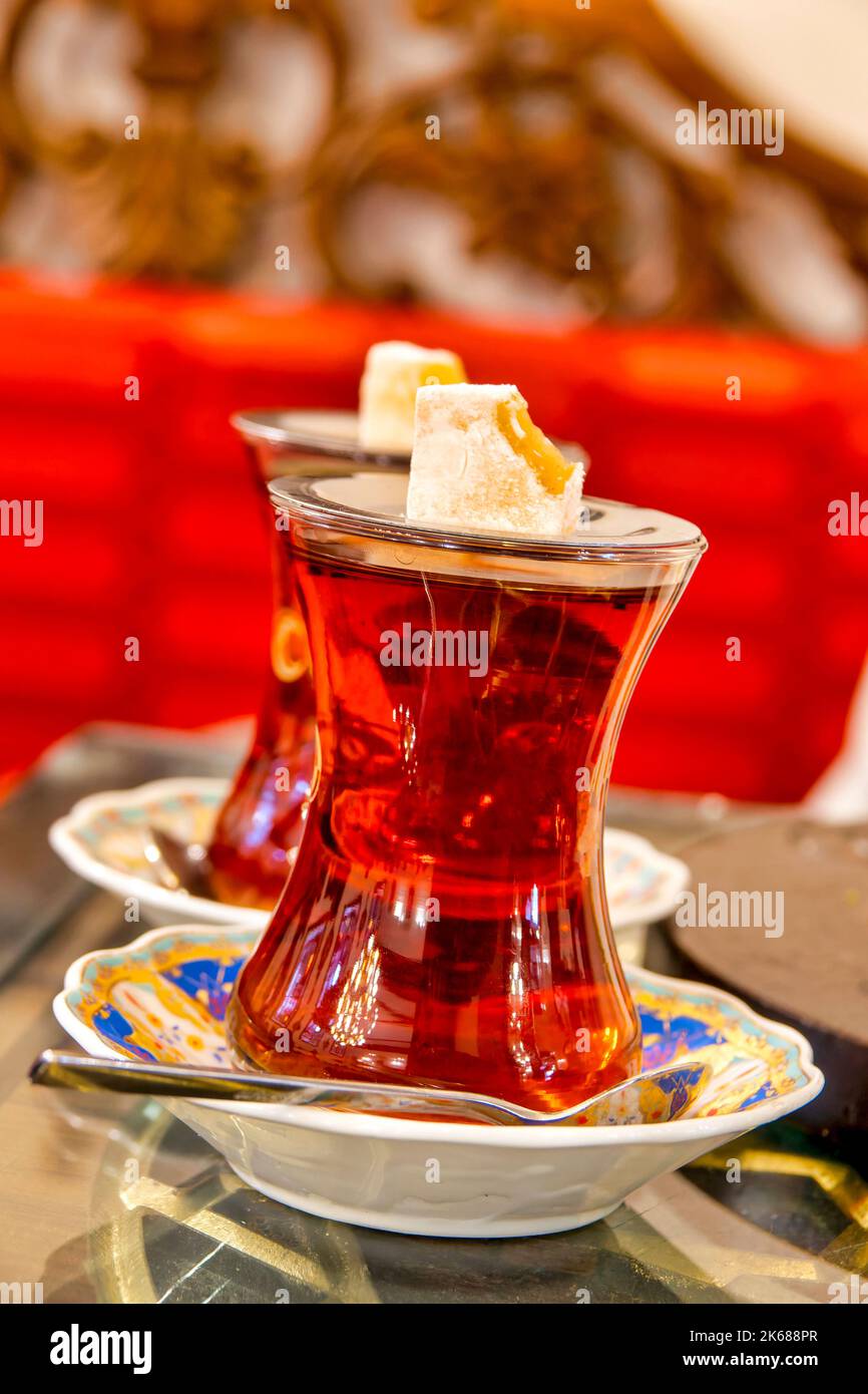 Turkish tea served in the typical manner, in a glass on a small saucer