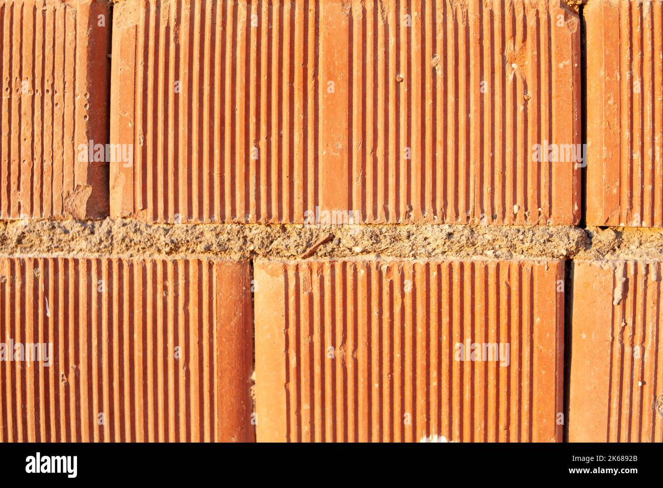 Red ceramic bricks close up. Keramoblock. Red brick wall texture