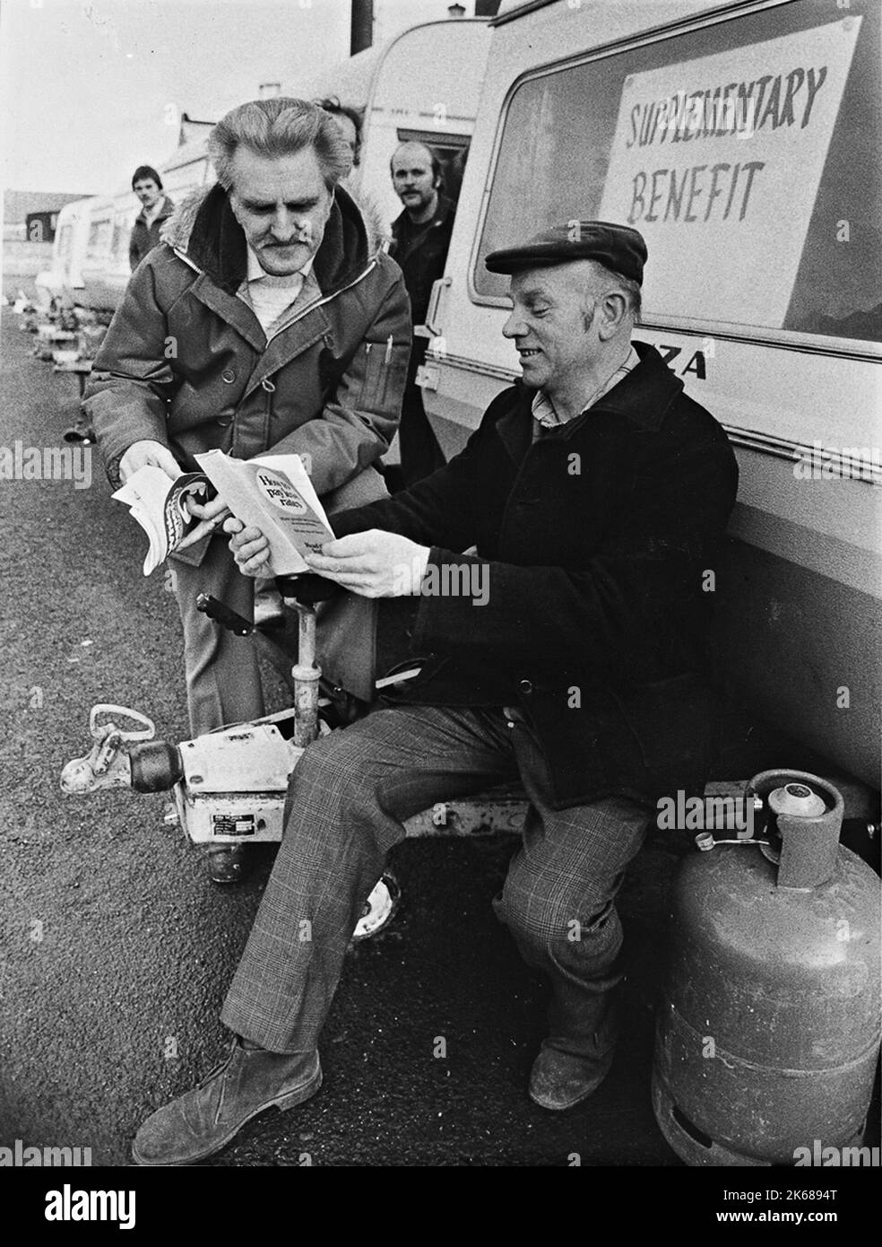 Redundant steel workers receiving benefit advice after receiving their final wage packets at Round Oak steel works Brierly Hill  in 1983 Stock Photo