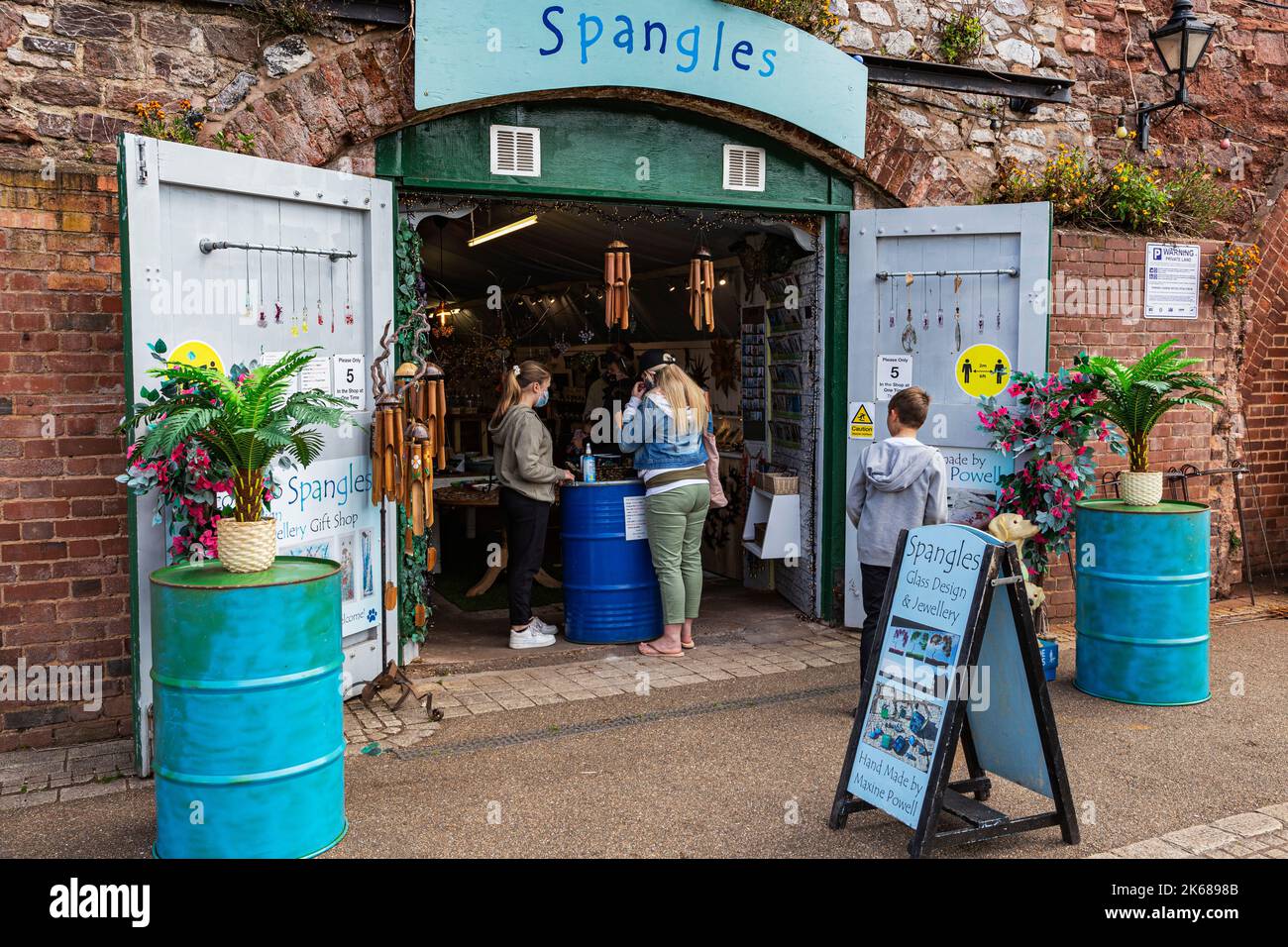 Detail of Open Doors and People Browsing at the Entrance to an Artisan
