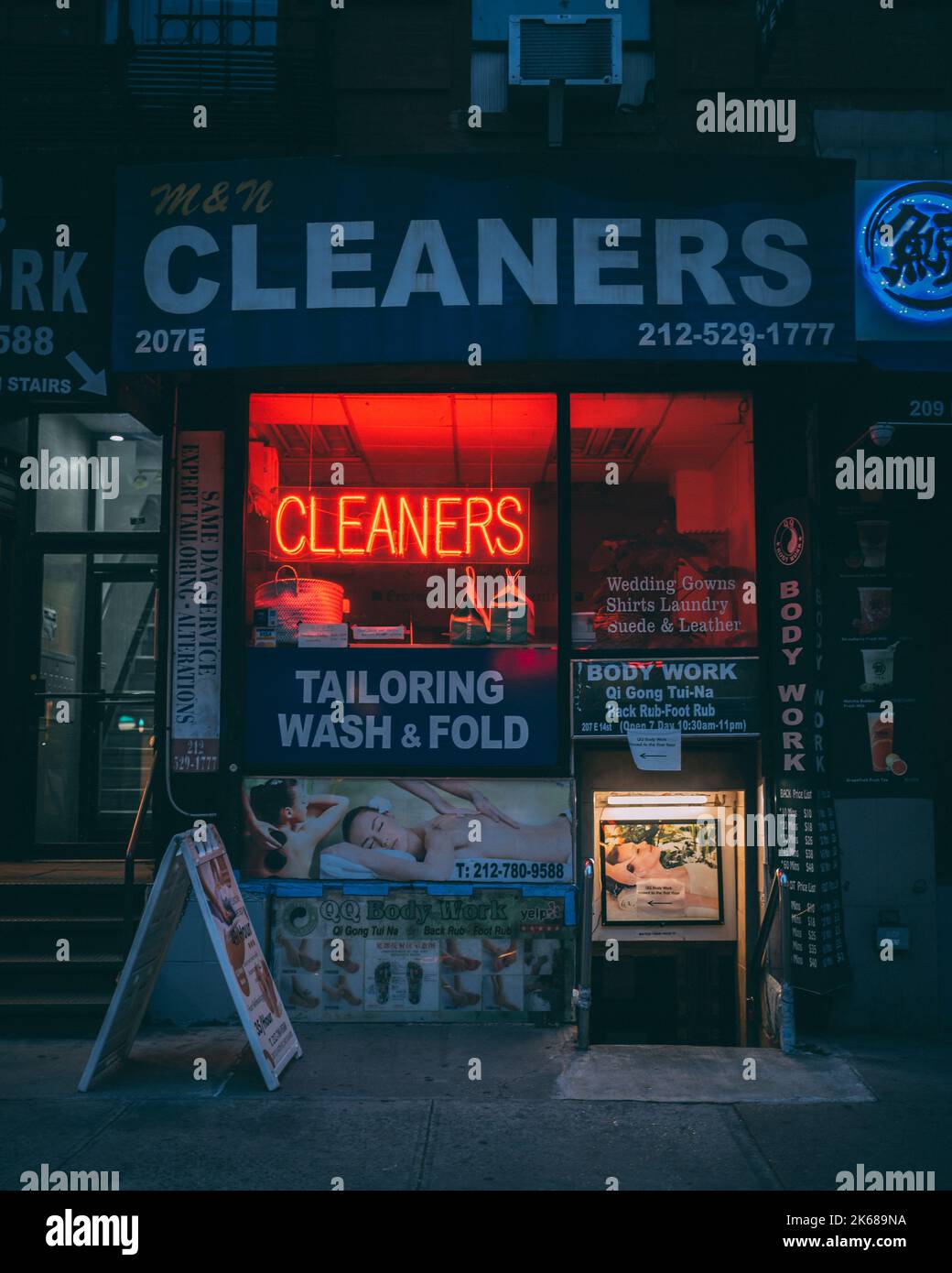 M&N Cleaners neon sign at night, in the East Village, Manhattan, New