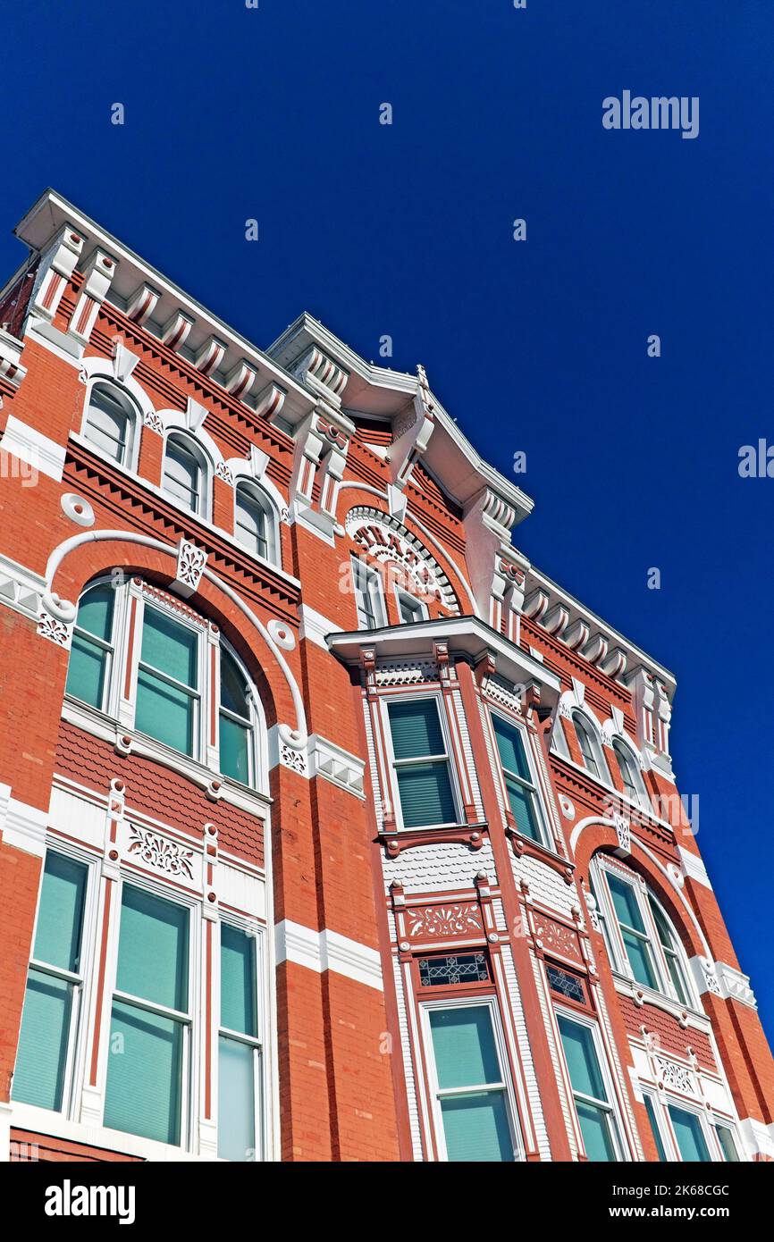 The ornate historic architecture of the Strater Hotel in the historic Durango, Colorado district is made of red brick and sandstone cornices and sills Stock Photo