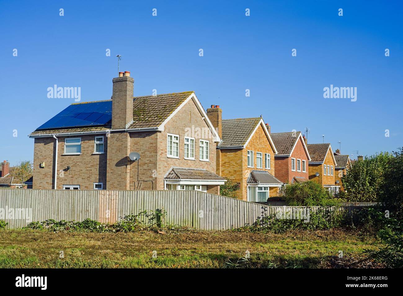 A row of 1970s detached houses on a sunny day Stock Photo