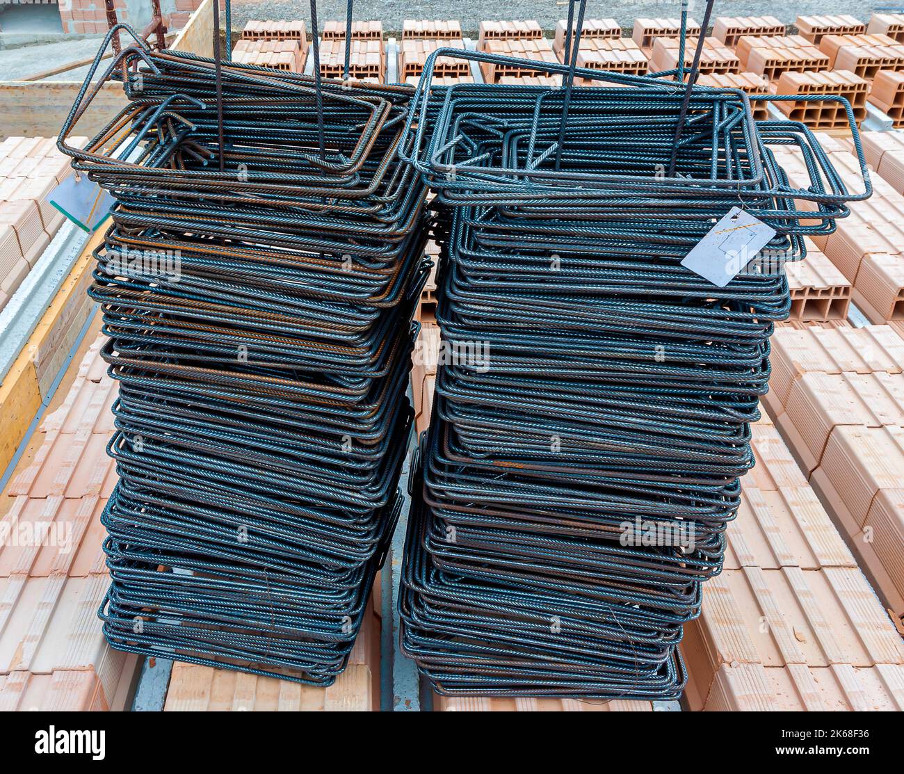 Pile of shaped iron brackets for reinforced concrete structure Stock