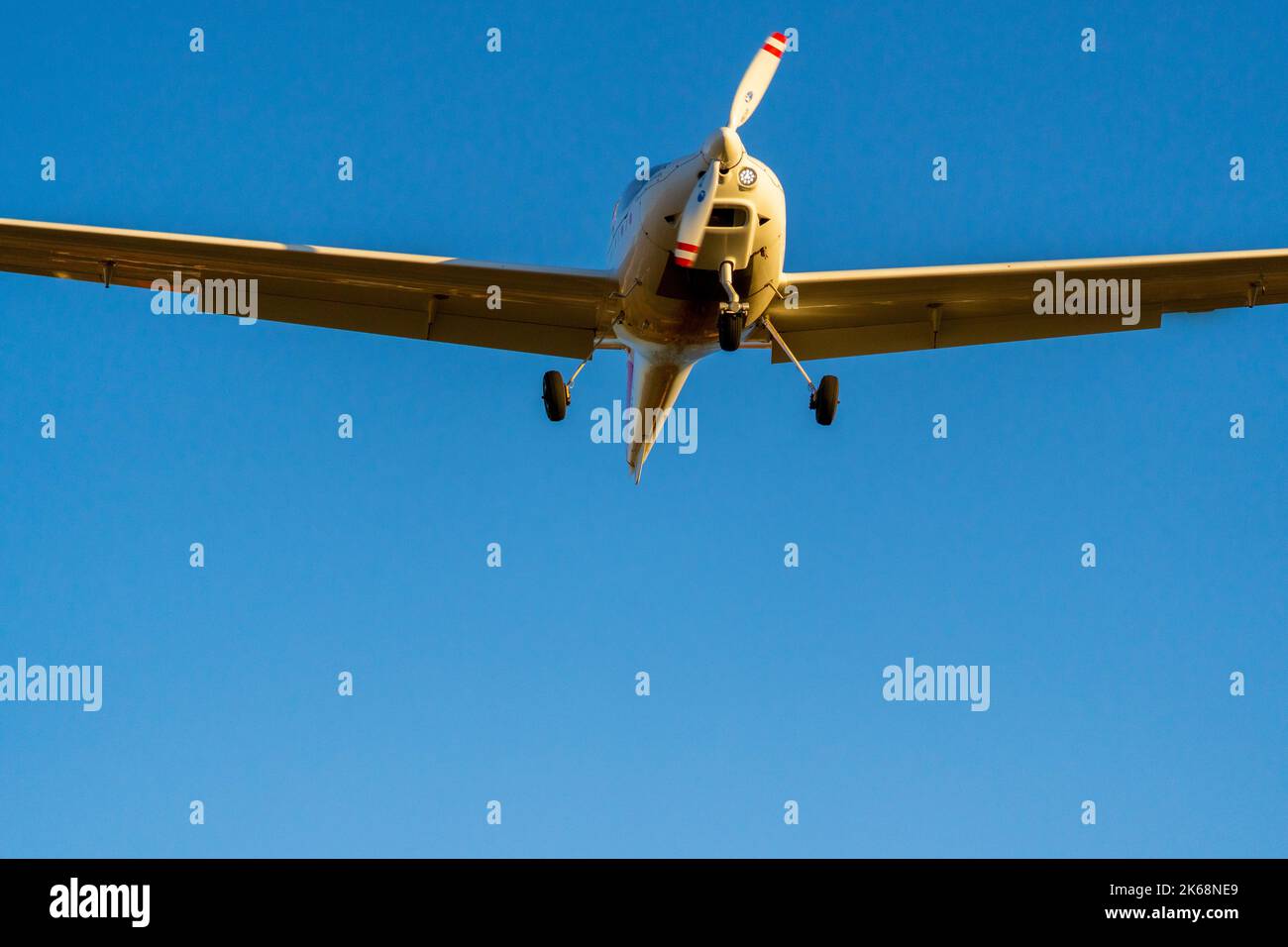 Singlepropeller plane landing from a nosedown view centred in the picture Stock Photo Alamy