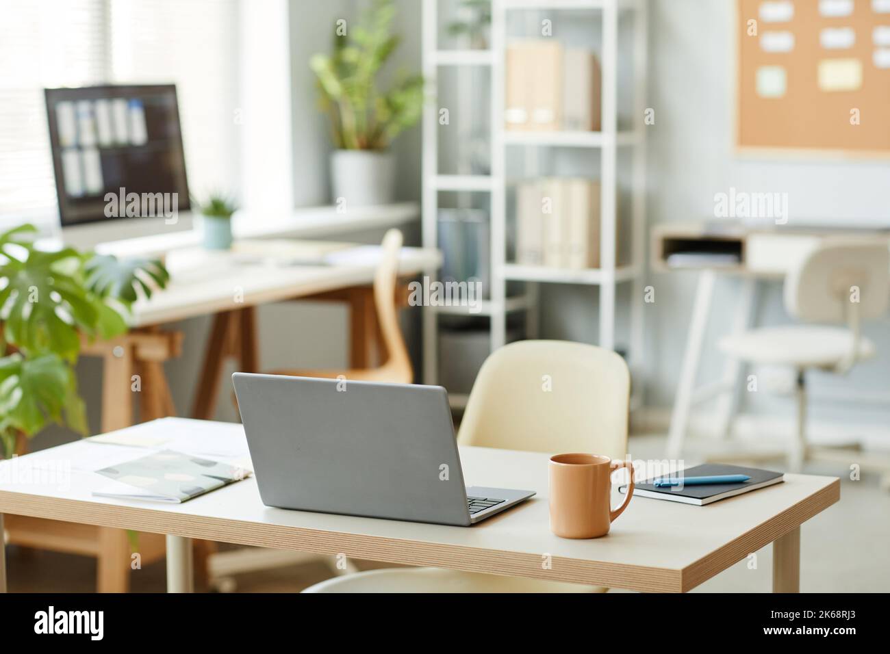 Background image of workplace design with open laptop on table in ...