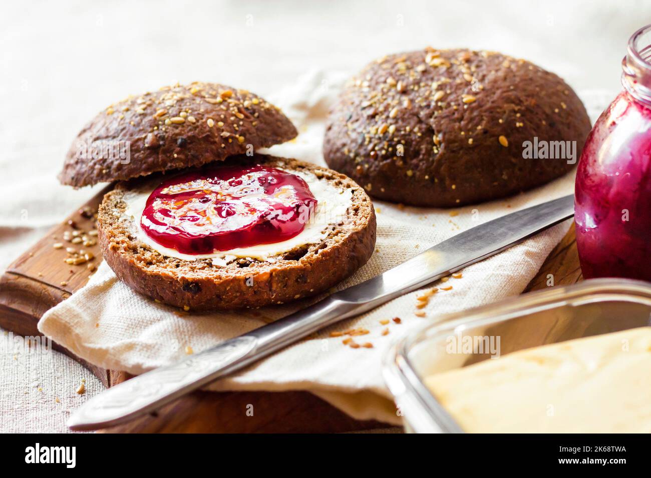Homemade rye buns with linseeds, sesame and white poppy seeds served