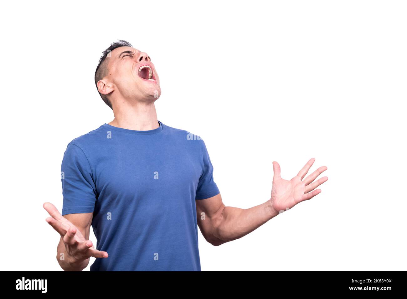 Man screaming in despair with his eyes closed Stock Photo - Alamy