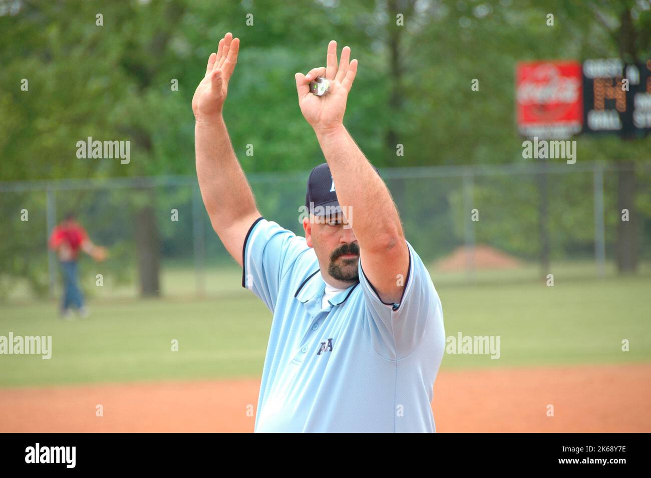 softball umpires for ASA in the US during games making calls and in