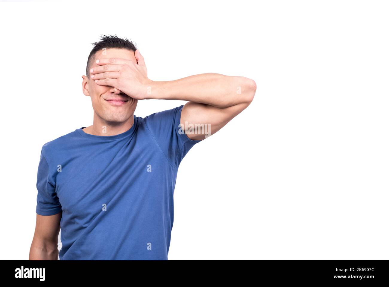 Man covering his eyes with his hand Stock Photo