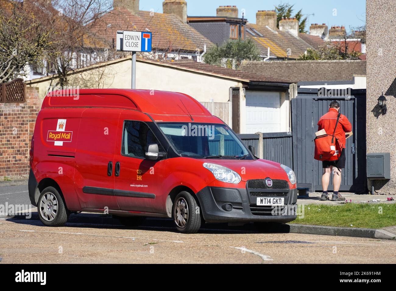 Royal Mail postman at work, England United Kingdom UK Stock Photo